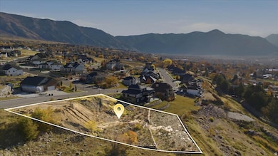 Aerial view of property's location featuring nearby suburban area and property parcel outlined