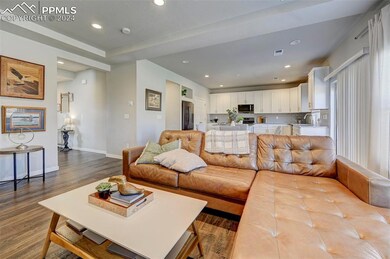 Living room with sink and light hardwood / wood-st