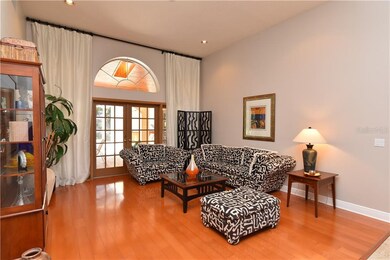 Formal living room with soaring ceilings and Frenc