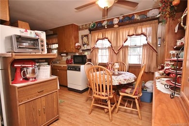 Dining area will be larger with big furniture piece removed!