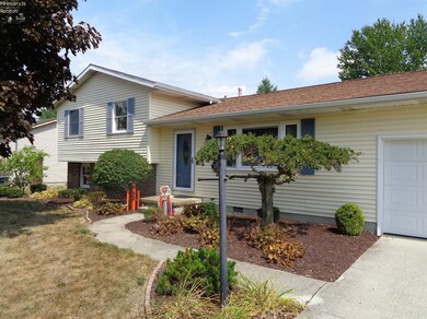 Vinyl sided, partial brick front, central air.
