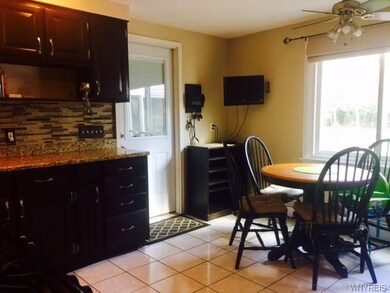 Kitchen wit side door to attached garage.