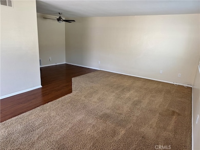 Carpeted Living Area Live and Bright.