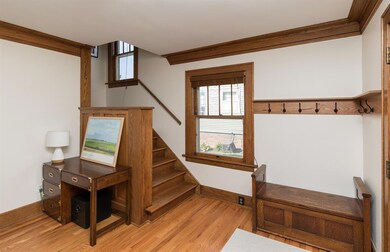 Drop zone area with hardwood flooring.