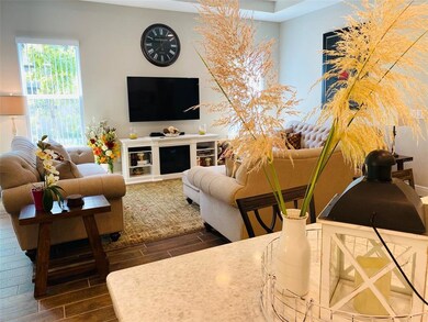 Large gathering area with electric fireplace.