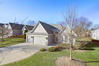 Home sits stately on landscaped lot