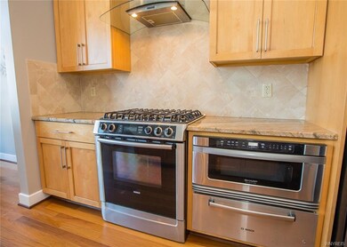 Kitchen with gas stove, range hood, microwave draw