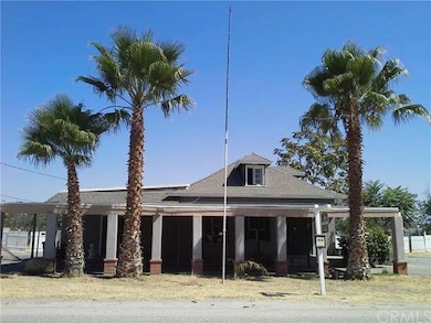 FRONT OF HOME WITH COVERED CARPORT