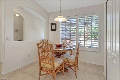 Dining area featuring light tile patterned floors,