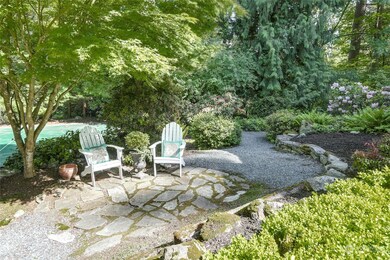 Shaded seating area out front near sport court and walking path.