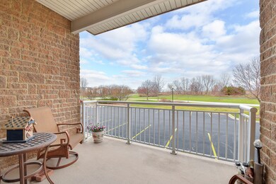 Private balcony overlooks green space and walking 