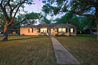 Ranch-style home with a front lawn
