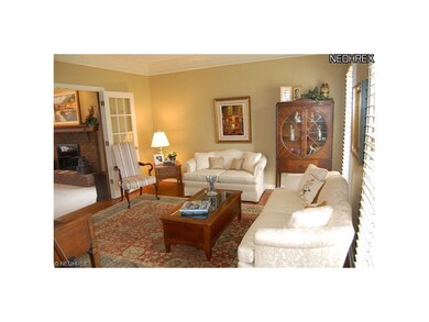 Formal Living Room with Hardwood Floor and Glass F