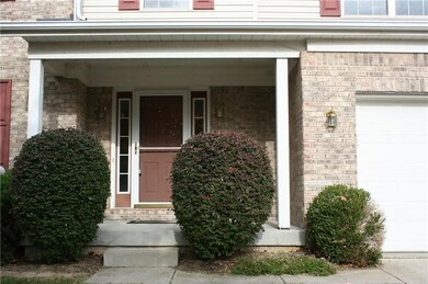 CLOSE UP VIEW OF THE FRONT ENTRY AND PORCH