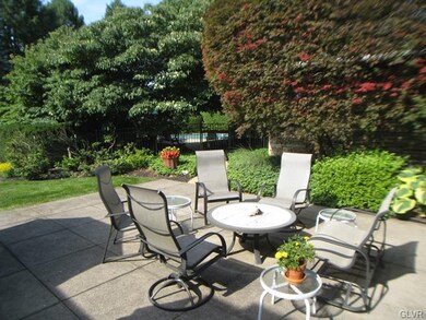 From the patio you catch a glimpse of the in groun