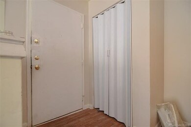 Foyer entry with coat closet.