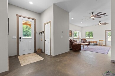 Foyer entrance featuring concrete floors, recessed lighting, and ceiling fan