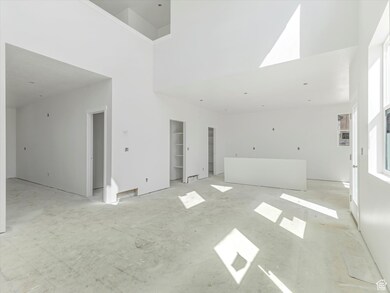 Spare room with a towering ceiling