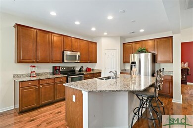 Kitchen features granite counter tops, stainless s