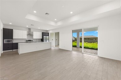 Unfurnished living room featuring visible vents, r