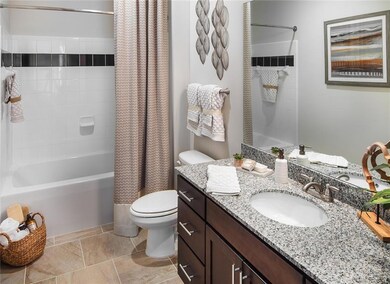 Full bathroom featuring shower / bath combo, toile