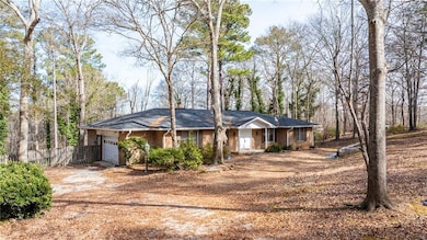 Ranch-style home featuring a garage