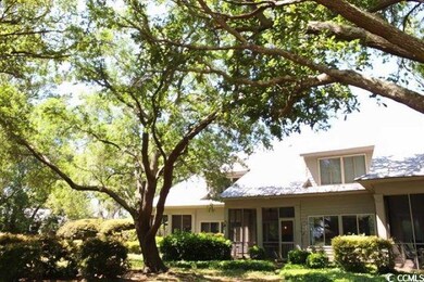 Back of house with a sunroom