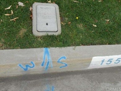 NEIGHBOR DIRECTLY ACCROSS FROM LOT(WATER METER)