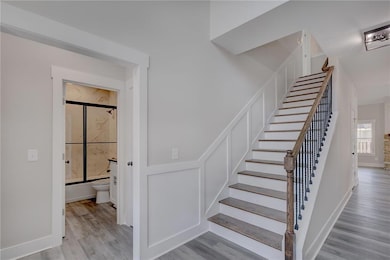 Stairway with hardwood / wood-style floors
