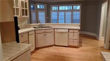 View from hallway looking into the kitchen and the