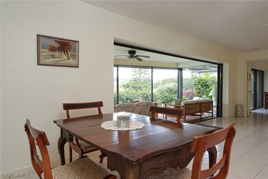 Dining room featuring ceiling fan and light tile f