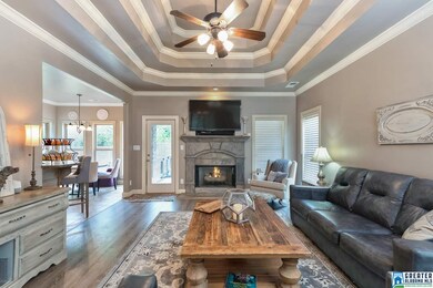 Beautiful tray ceiling and hardwood floors in the 