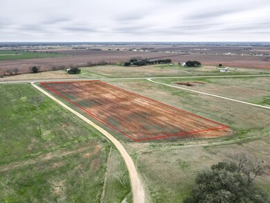 Birds eye view of property with a rural view