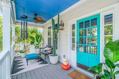 Deck featuring ceiling fan and a porch