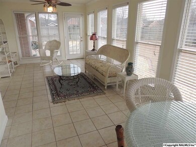 Door leads to large backyard & concrete patio area