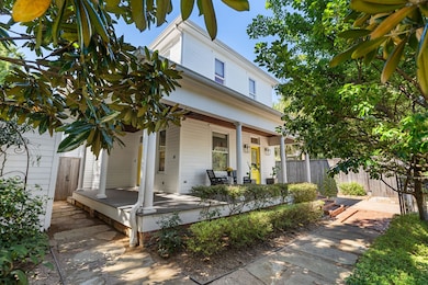 From the front porch, two cheery yellow original doors with stained glass windows and transoms open to the stately foyer and private study.