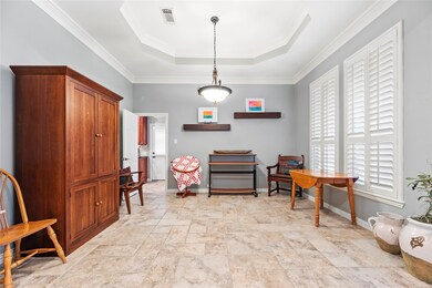 This dining room features tile flooring, large win
