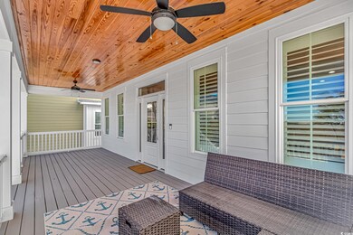 Wooden deck with outdoor lounge area, ceiling fan,