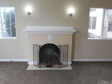 wood burning fireplace in living room
