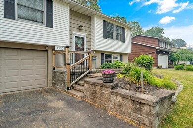 Front view with close-up of front porch/steps.
