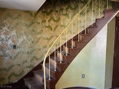 Stairway with wallpapered walls