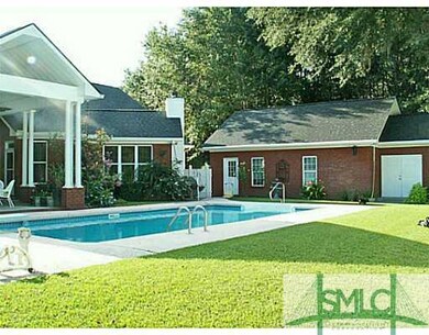 Exterior Back. In ground Pool and Detached Garage