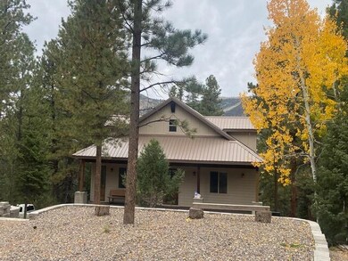 beaver cabin parking and front of home