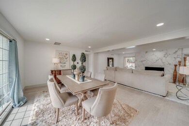 Formal dining area is very defined, open yet separ