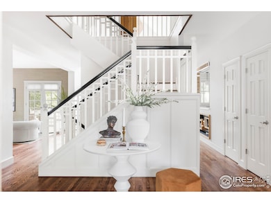 Step inside to a welcoming foyer where hardwood floors extend across beautifully appointed living spaces.