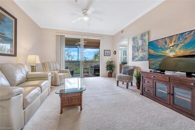 Carpeted living area with visible vents, ornamenta