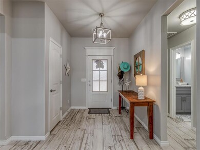 Entrance foyer featuring a notable chandelier and 