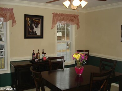 Dining Room - Bright with crown moulding, chair ra