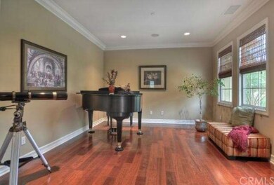 Enter to a cozy entry space flanked by this formal