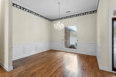 Formal Dining room with wainscoting